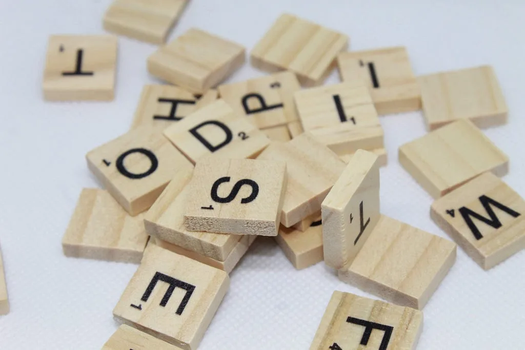 Scattered wooden letter tiles